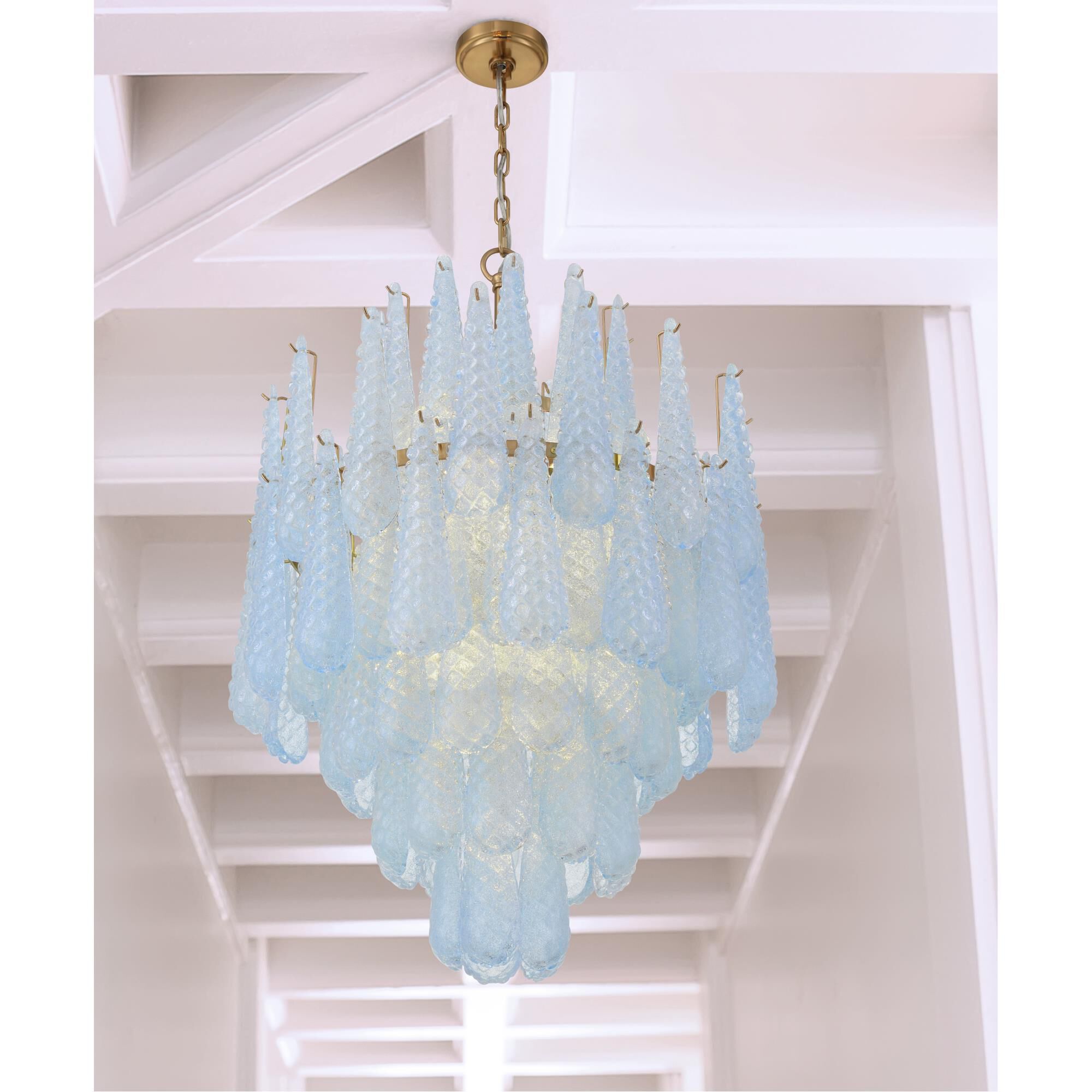 Shown in Aged Brass finish and Sand Blue glass